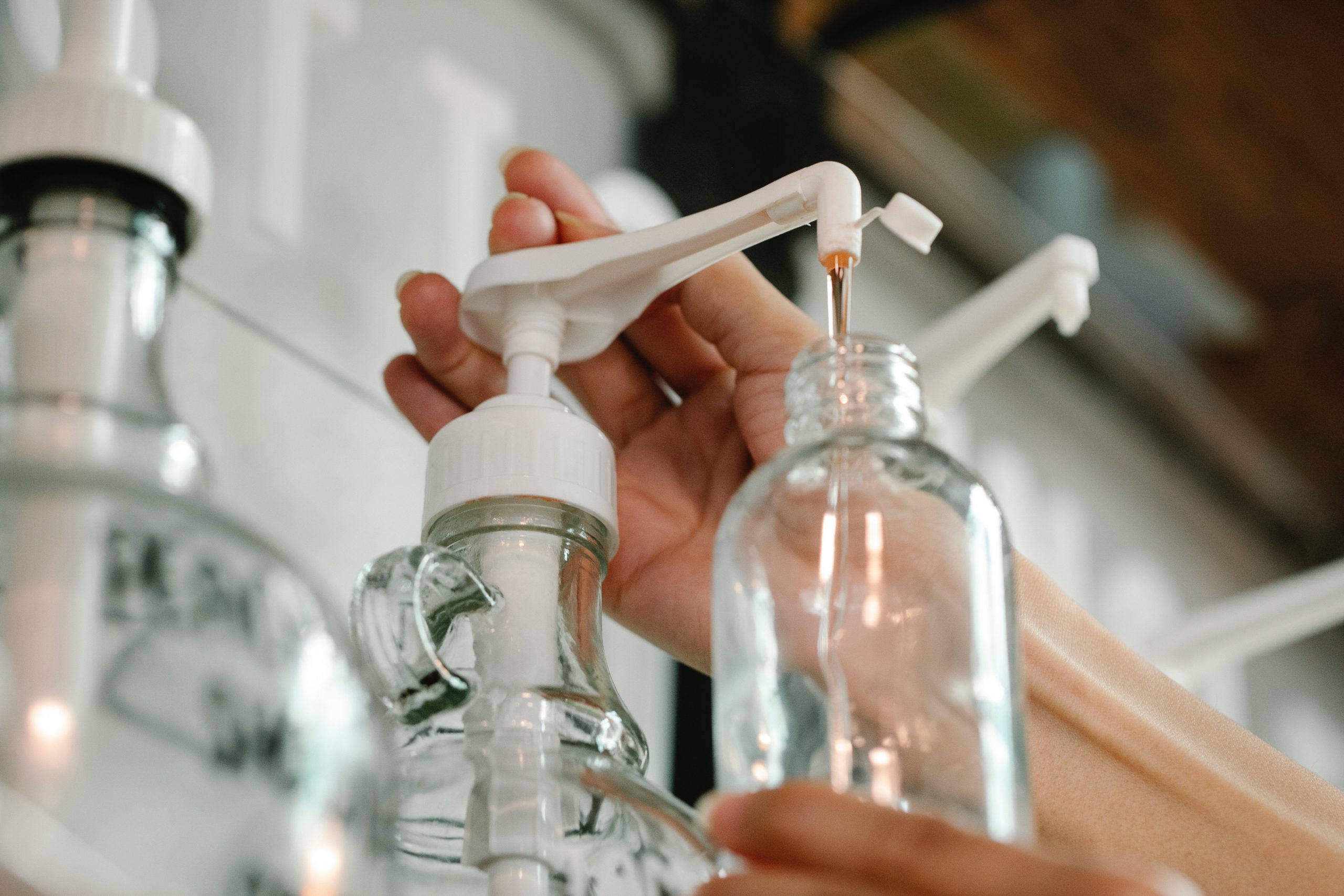 Bottle being filled with disinfectant