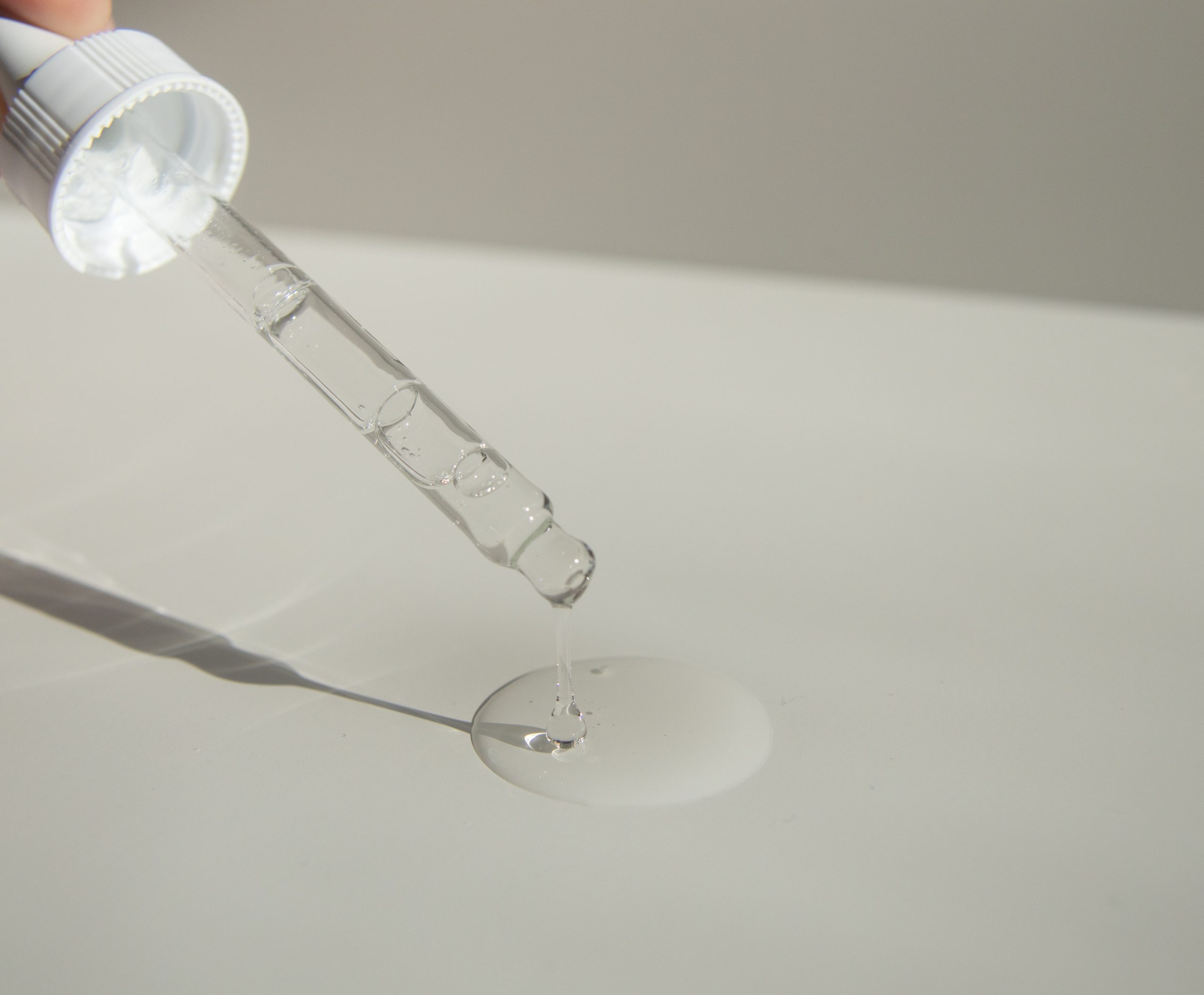 pipette dropping liquid on surface